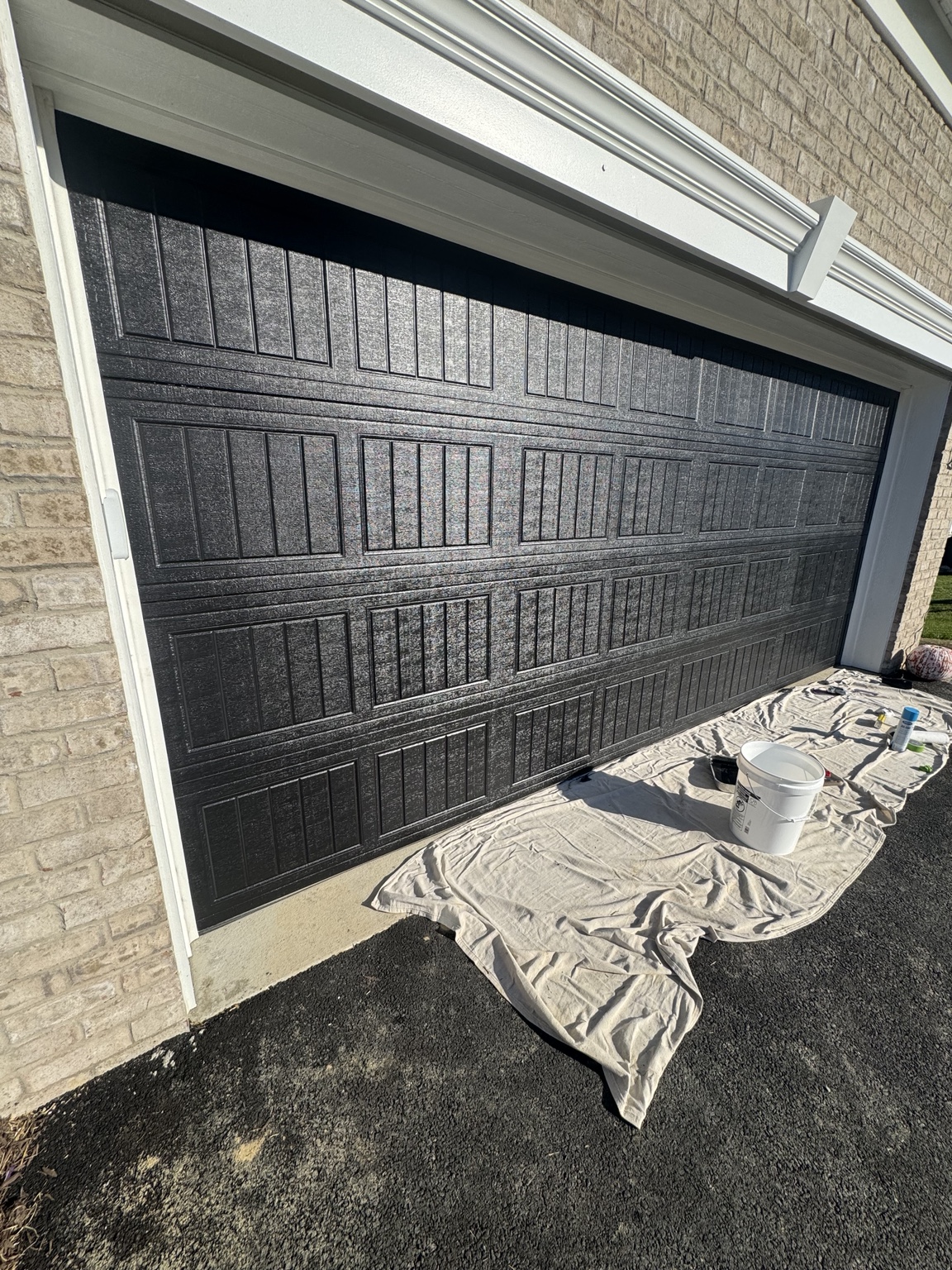 Close-up of black garage door finish and panel detailing